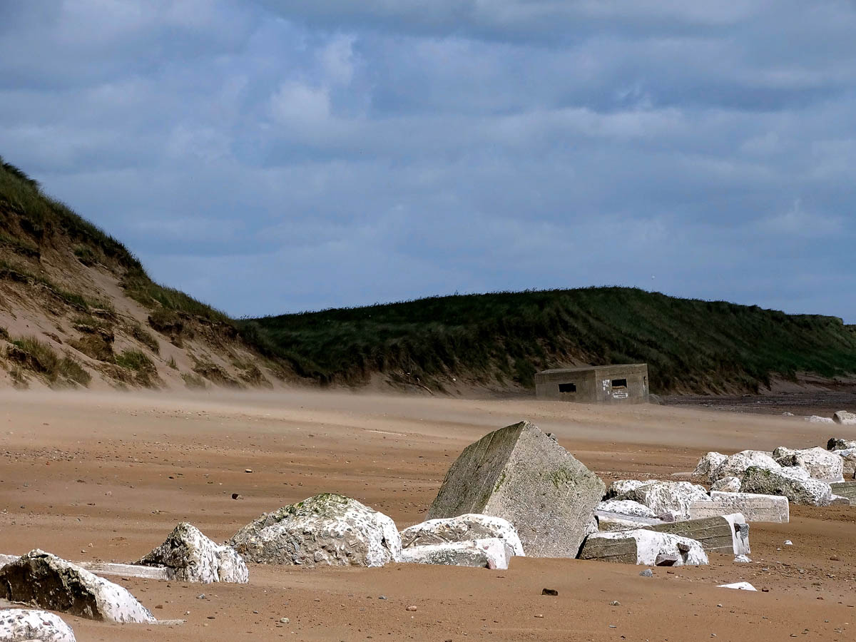 A World War Two pillbox and concrete anti-tank defences at the northern end of Aberdeen Beach near Donmouth