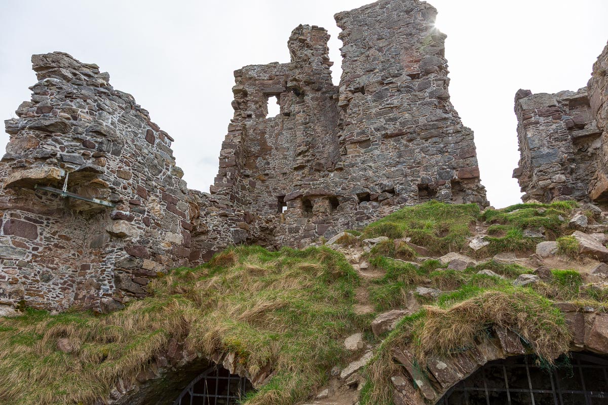 Looking up through the interior of Ardvreck Castle showing the remaining walls and vaulted cellar openings