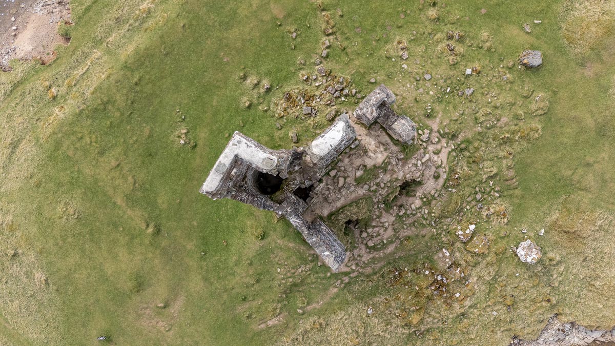Bird's-eye aerial view looking directly down on the ruins of Ardvreck Castle