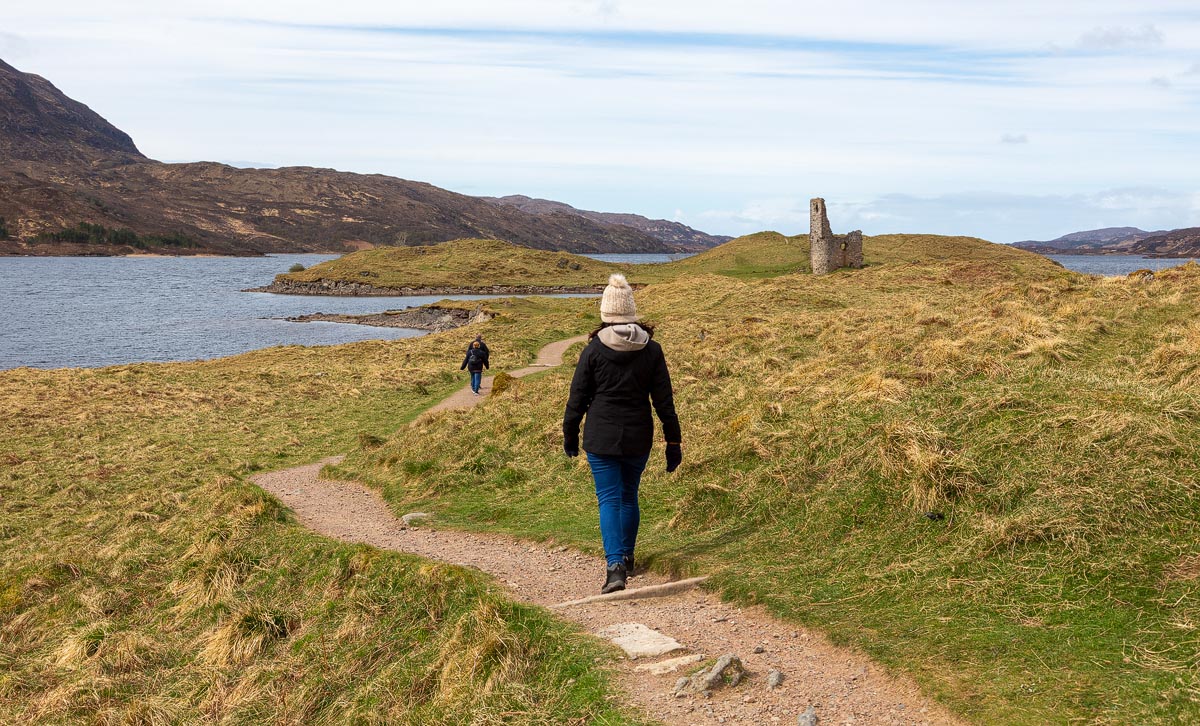 Walking the path towards Ardvreck Castle on its promontory in Loch Assynt