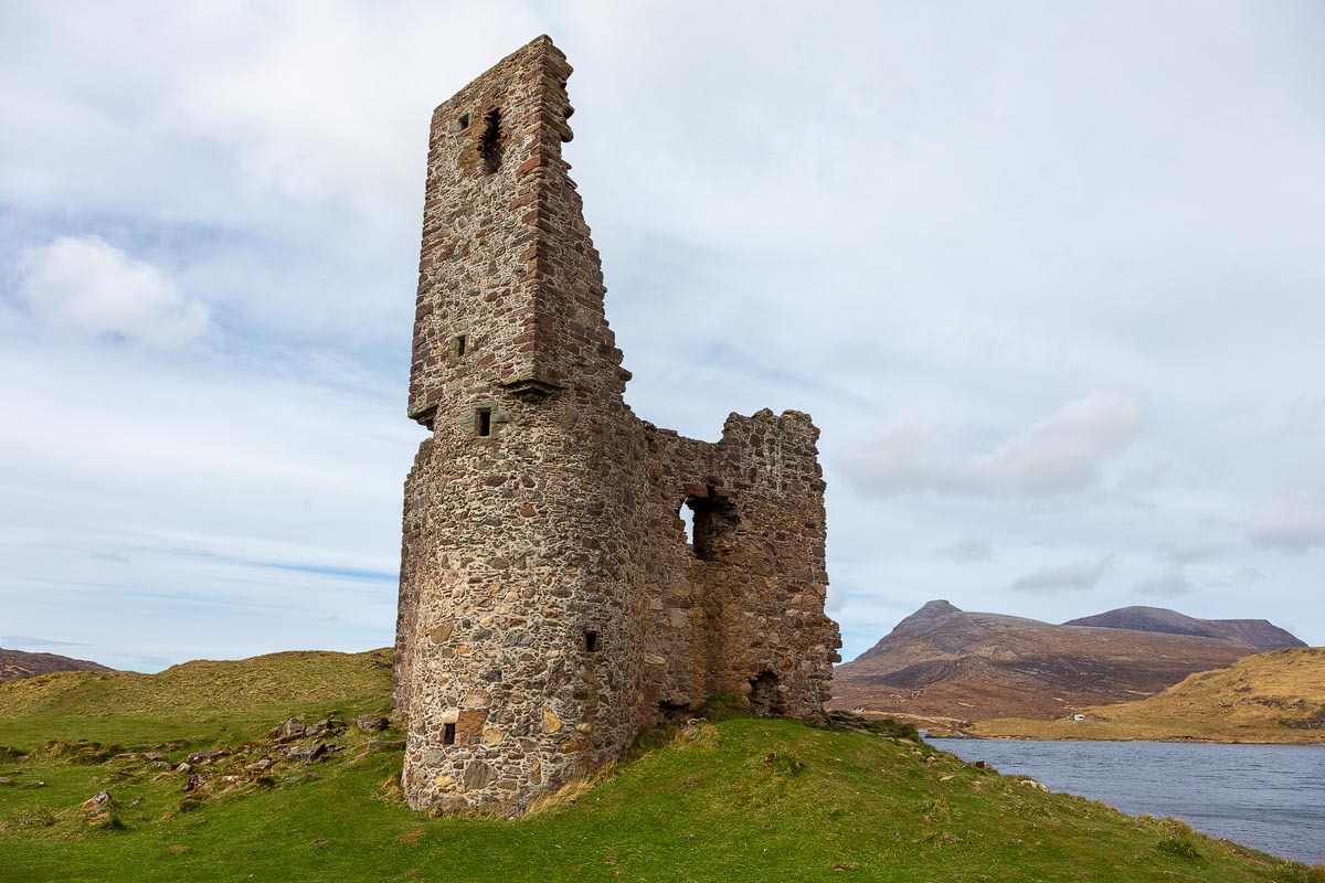 The imposing tower of Ardvreck Castle with the mountain Quinag rising in the background