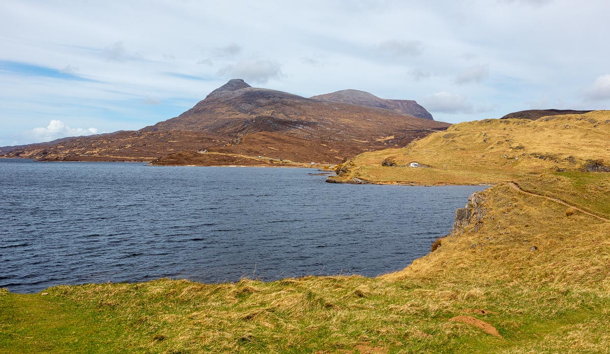 The view across Loch Assynt towards the mountain Quinag from the Ardvreck Castle promontory