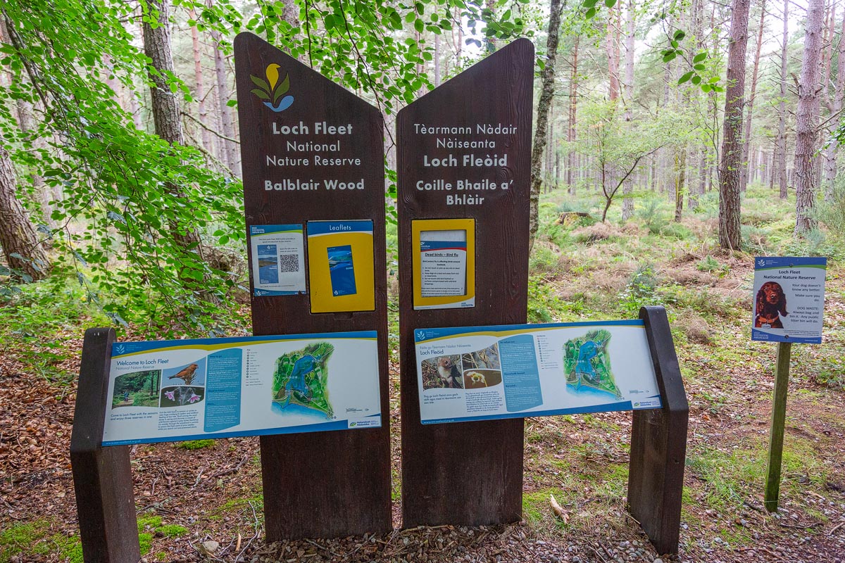 NatureScot information boards at the entrance to Balblair Wood showing bilingual English and Gaelic signage