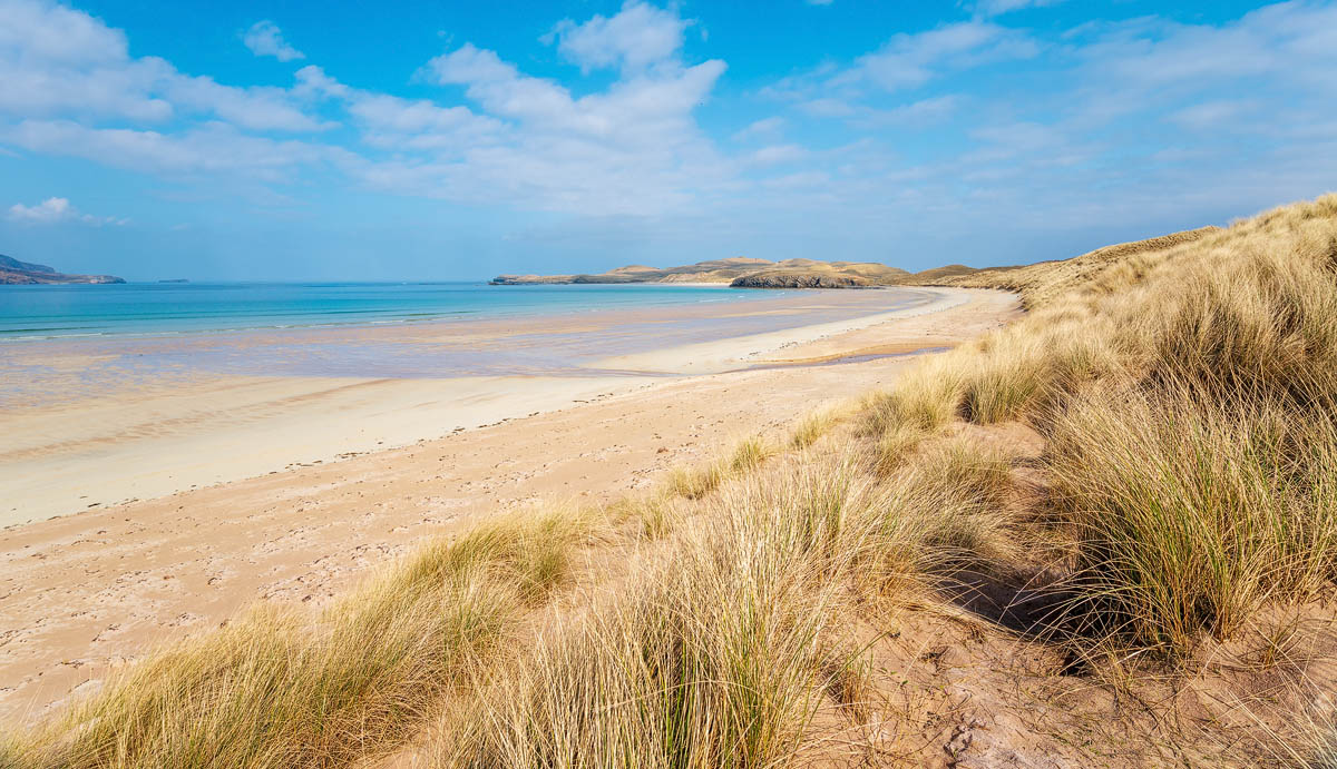 Balnakeil Beach near Durness with expansive golden sand, marram grass dunes, and turquoise water