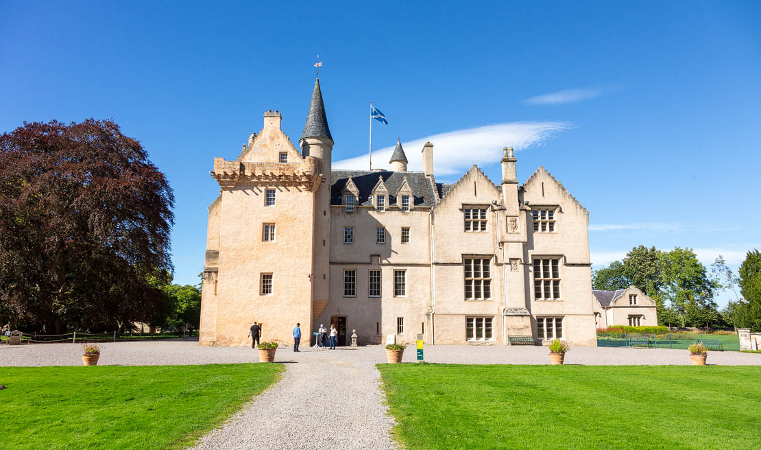 A historic castle in Moray. Gentle moray countryside surround the ancient building.