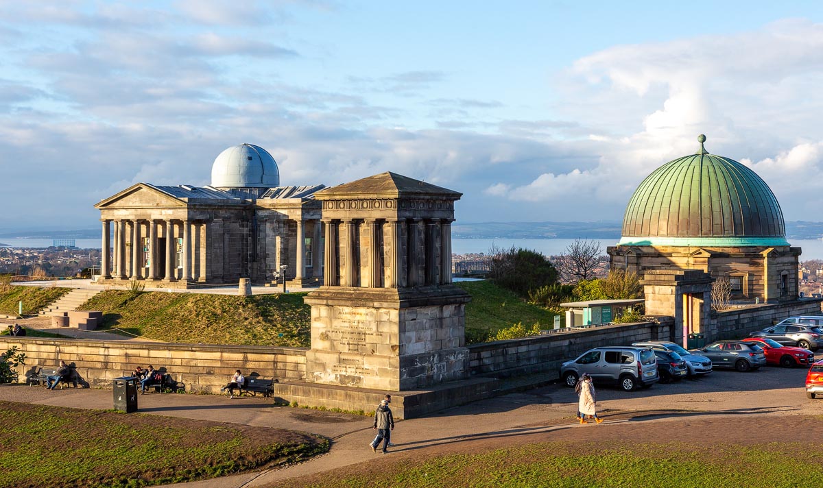 The City Observatory and distinctive green copper dome on Calton Hill, with the Firth of Forth beyond