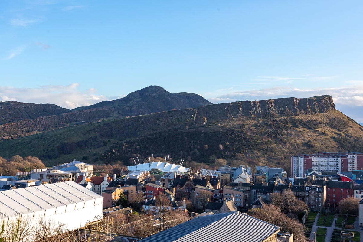 Arthur's Seat and Salisbury Crags viewed from Calton Hill, with the Scottish Parliament building below