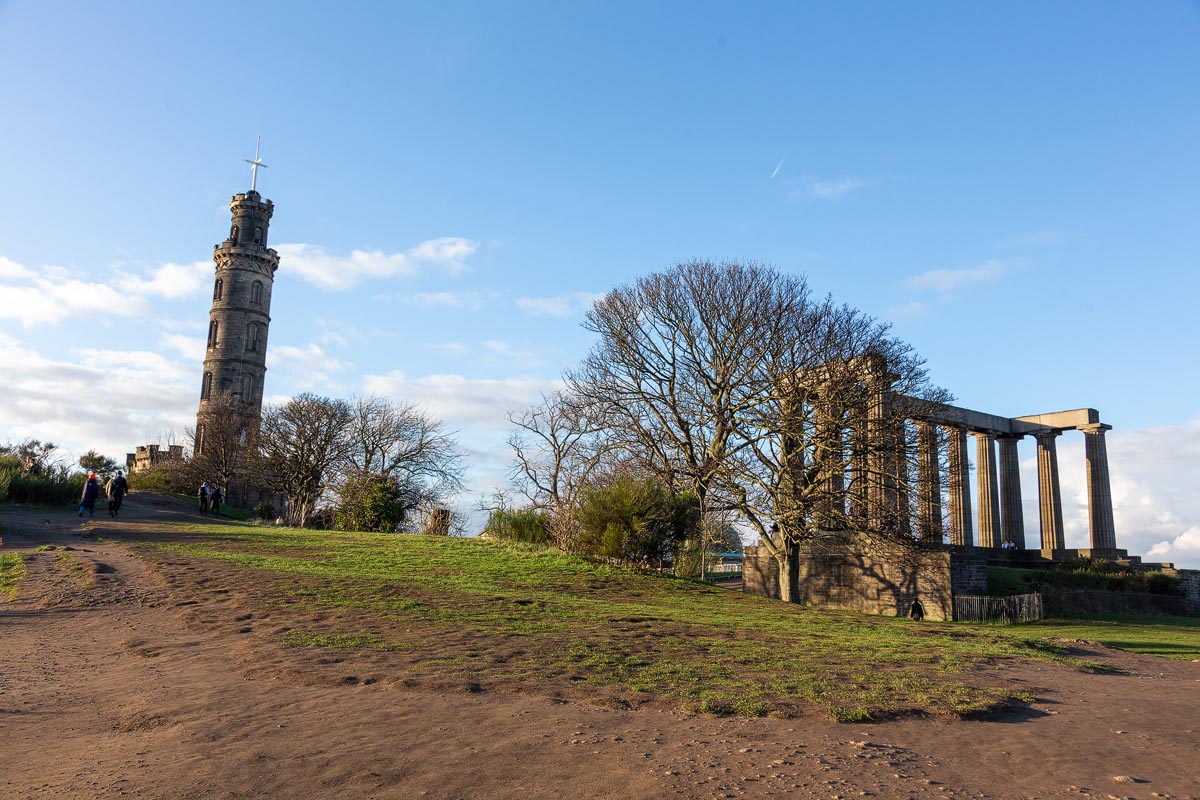 The Nelson Monument and National Monument standing side by side on the summit of Calton Hill