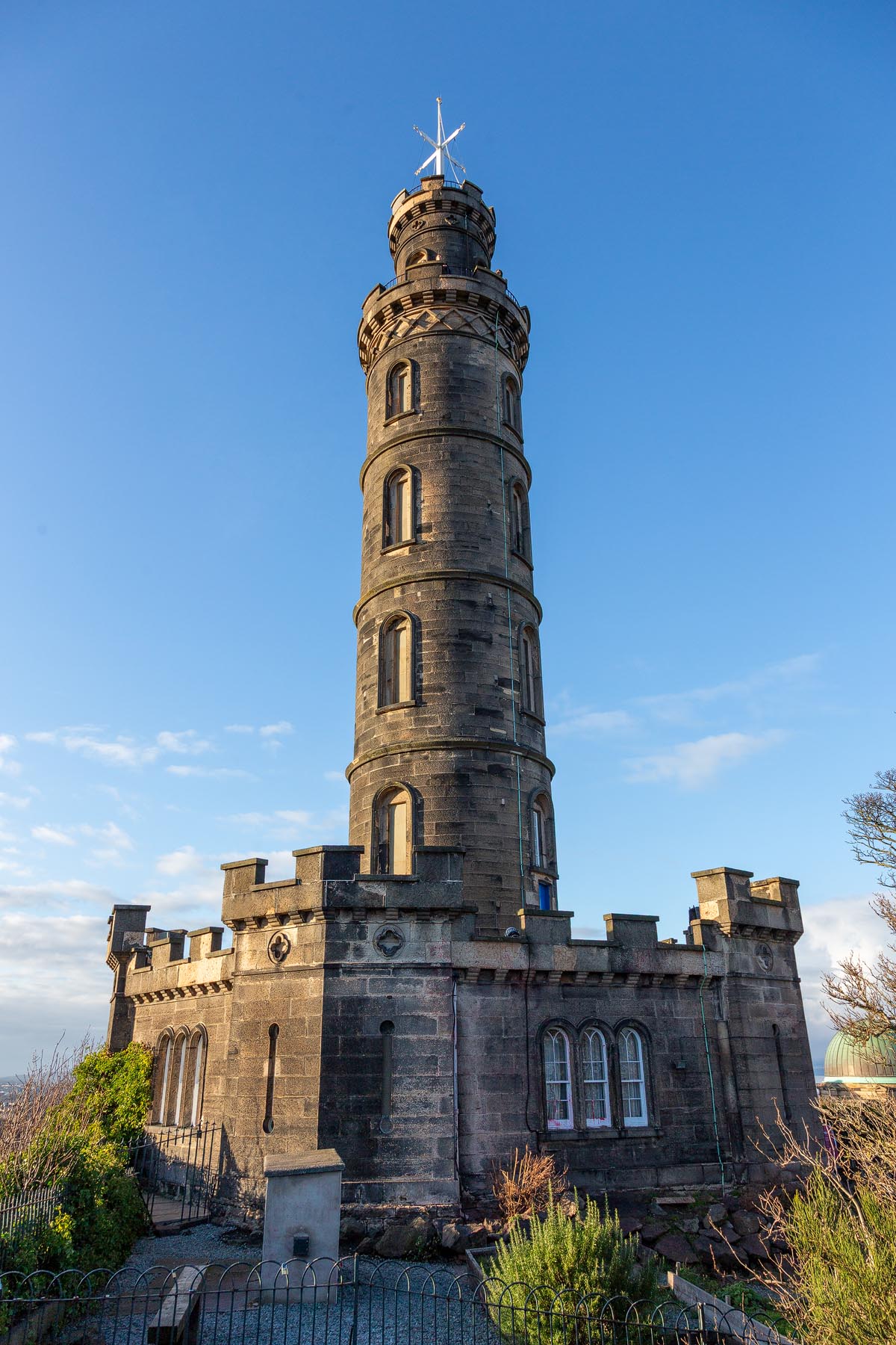 The Nelson Monument tower on Calton Hill with its castellated base and time ball cross at the top