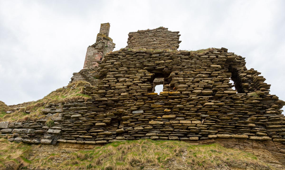 Close-up of ruined Caithness flagstone wall showing the distinctive layered construction technique