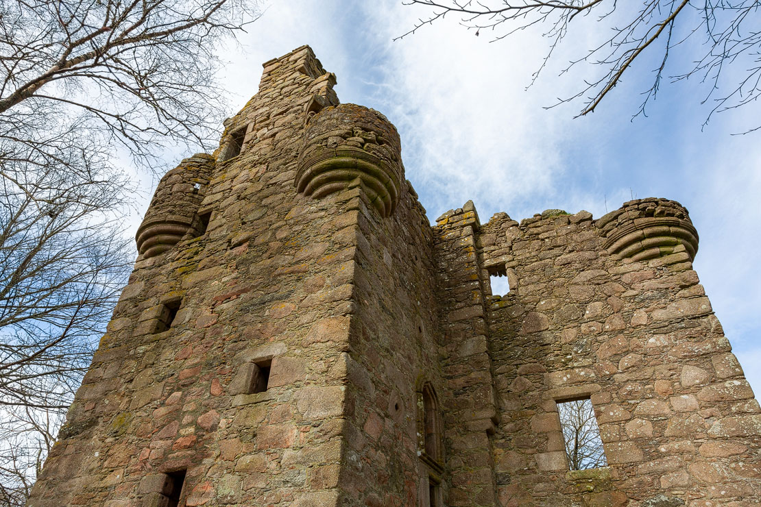 The imposing tower of Corse Castle with its distinctive corbelled turrets reaching skyward