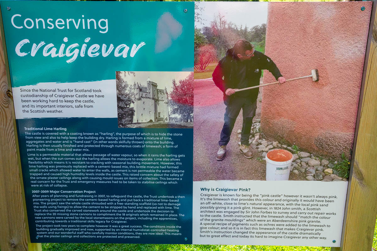 Information board about conserving Craigievar Castle explaining the traditional lime harling process and why the castle is pink