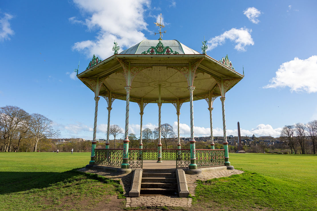 Front view of the Duthie Park bandstand showing the boarded timber underside of the roof and ornate barley-sugar columns