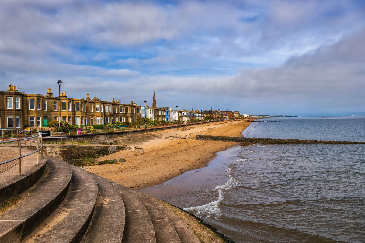The sandy beach and promenade at Portobello with Victorian buildings lining the seafront