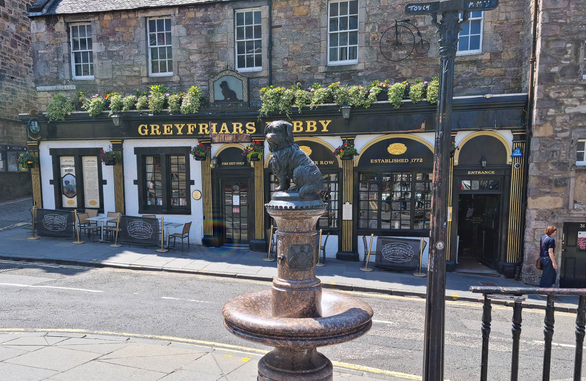 The Greyfriars Bobby statue outside the Greyfriars Bobby pub on Candlemaker Row in Edinburgh