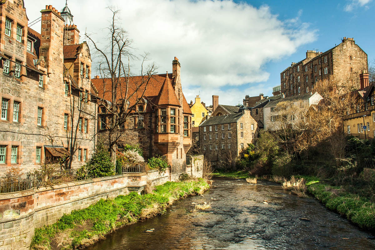 Historic stone buildings of Dean Village along the Water of Leith on a bright winter day