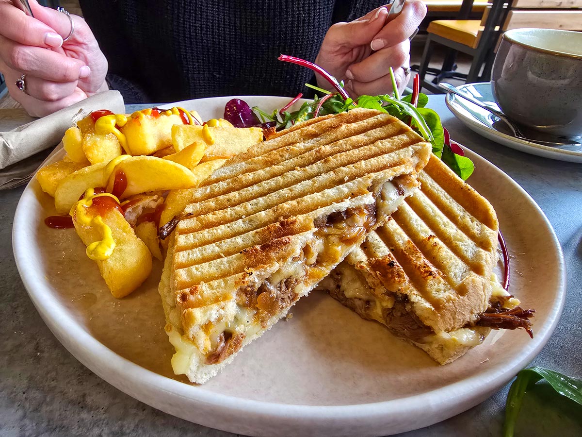 A toasted panini with chips and salad served at The Gannet restaurant in Edinburgh Zoo
