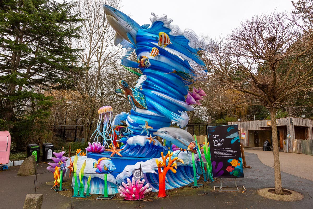 A towering ocean wave sculpture with shark, sea turtle, dolphins and jellyfish at Edinburgh Zoo