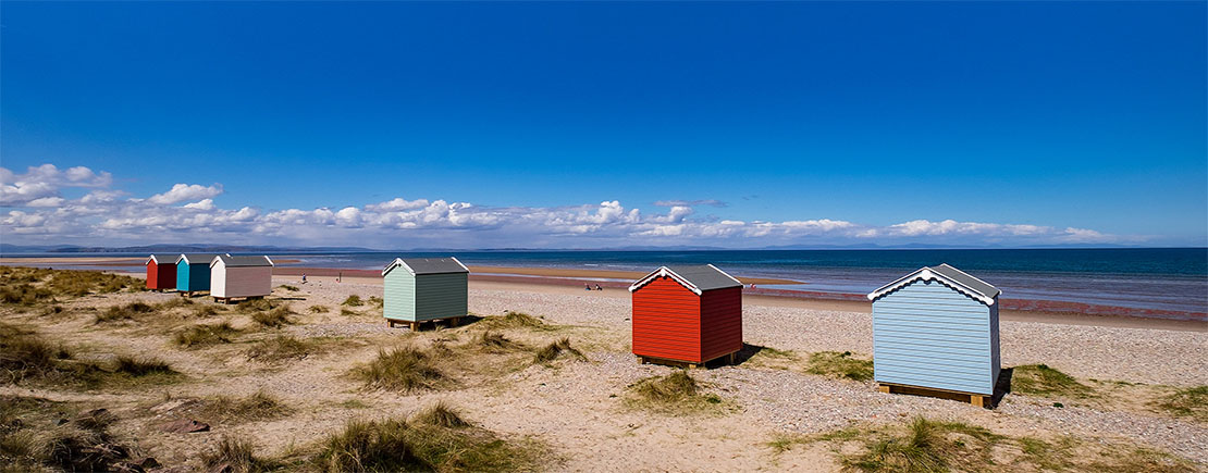 Findhorn Beach with colourful huts.