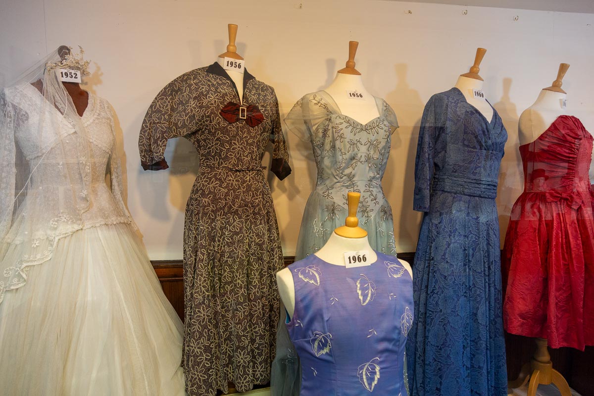 Vintage dresses from the 1950s and 1960s displayed on mannequins inside the museum