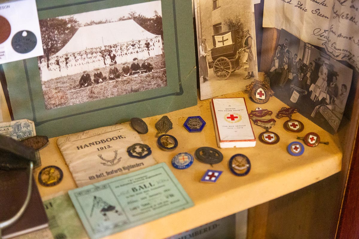 A display of First World War memorabilia including Seaforth Highlanders and British Red Cross items