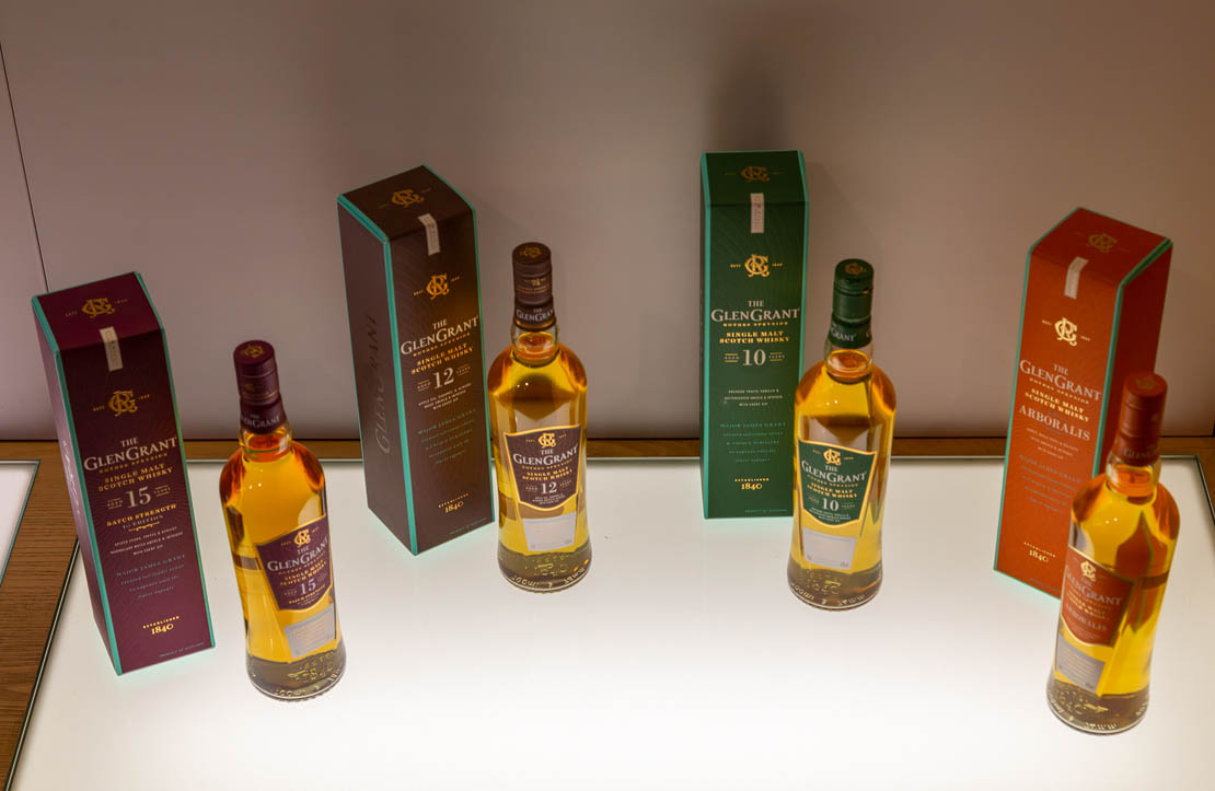Four bottles of Glen Grant Whisky.