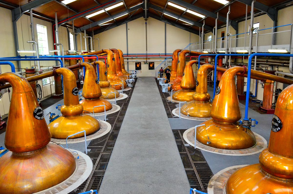 The impressive Glenfiddich stillhouse with two rows of copper pot stills lining a central walkway in Dufftown, Speyside