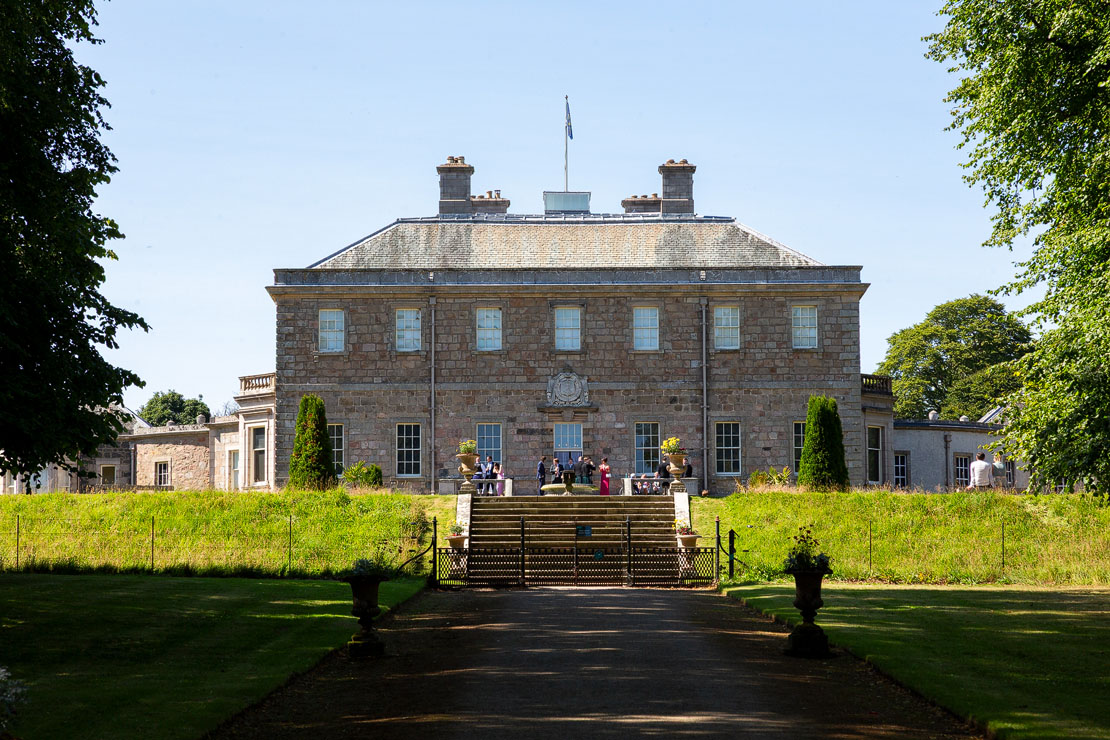 Haddo House viewed from the Scots Mile approach with entrance gate