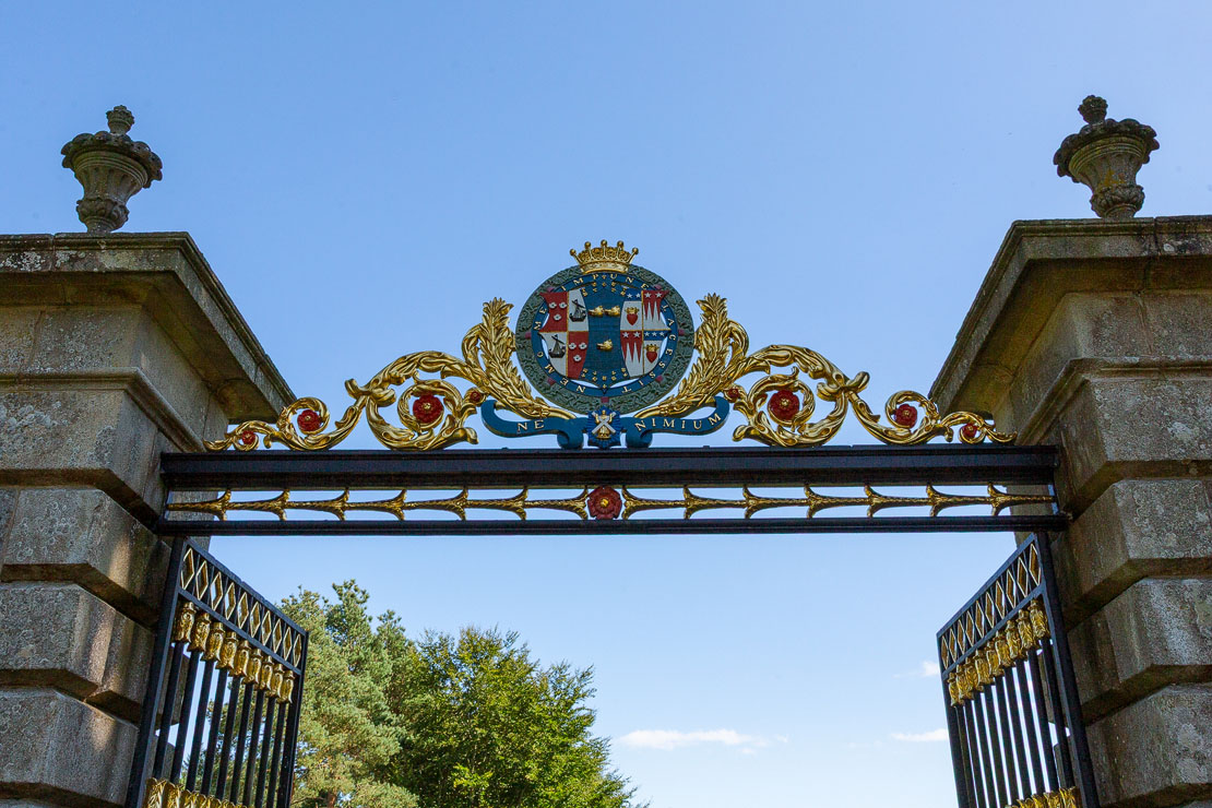 The ornate gilded coat of arms atop the Golden Gates at Haddo House