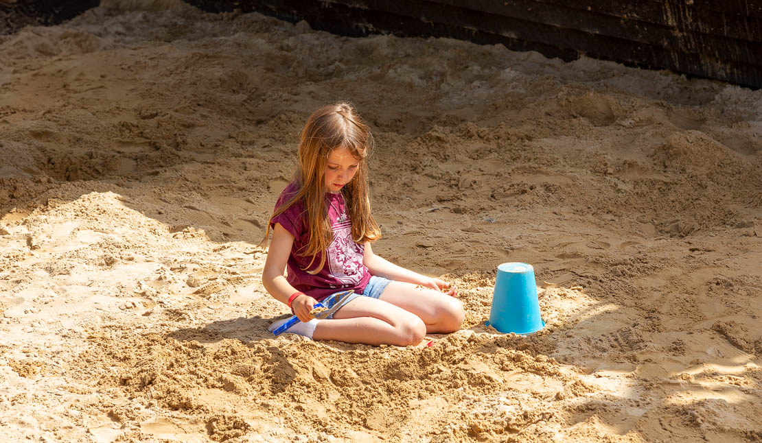 Lauren in the sand pit.