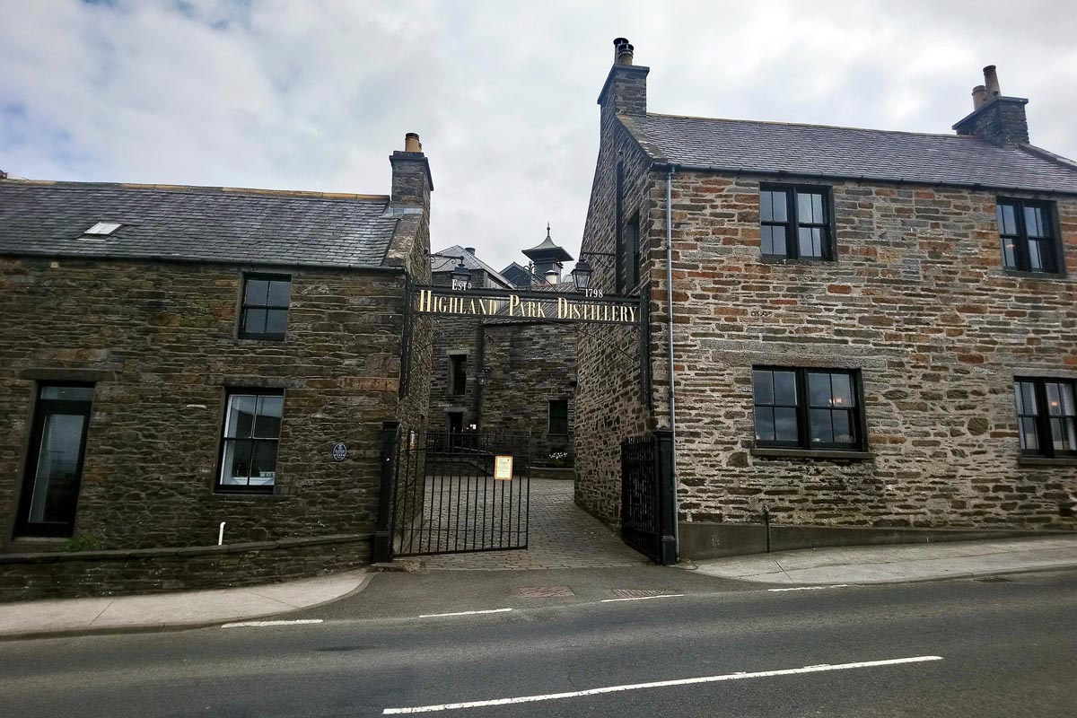The entrance to Highland Park Distillery in Kirkwall, Orkney, with gold lettering reading Highland Park Distillery Estd 1798