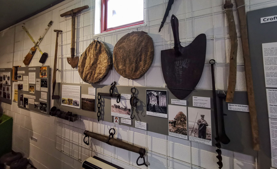 Farming tools mounted on the wall.