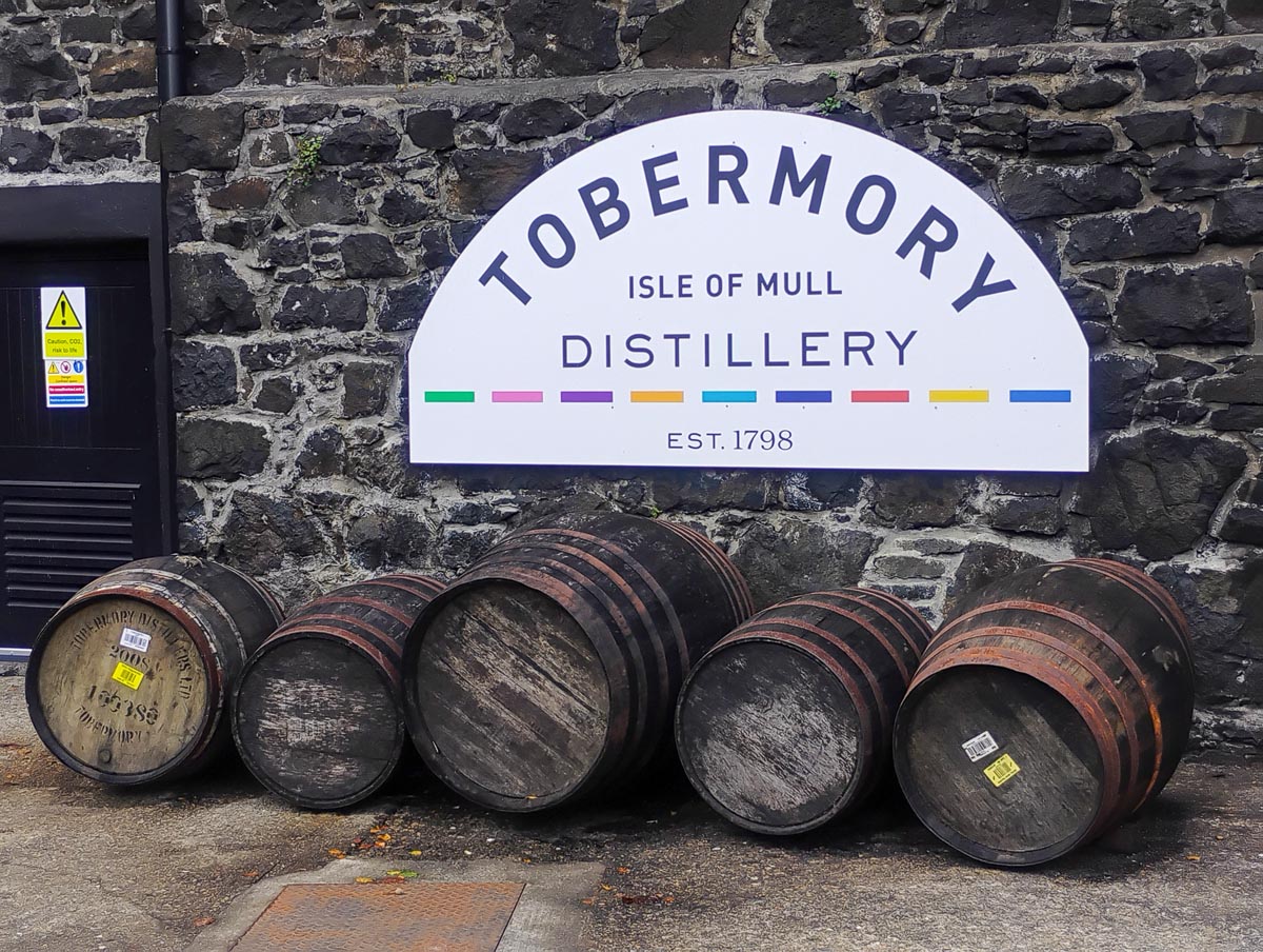 Whisky barrels lined up outside the Tobermory Distillery on the Isle of Mull established in 1798