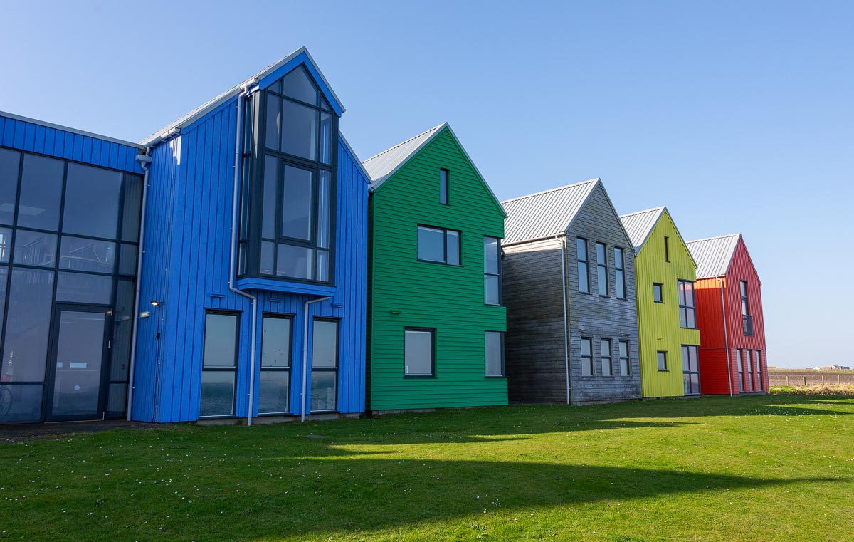 The brightly coloured self-catering lodges at the Inn at John o' Groats