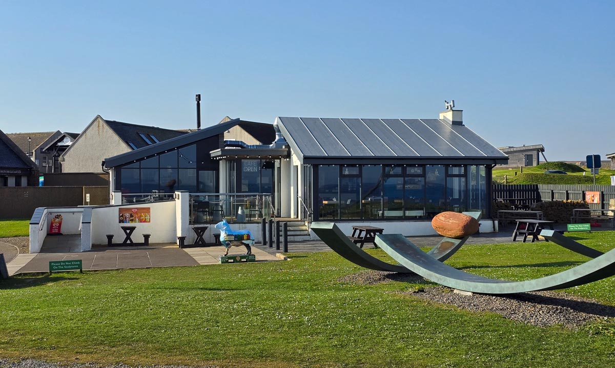 The modern café at John o' Groats with its glass frontage and outdoor sculptures