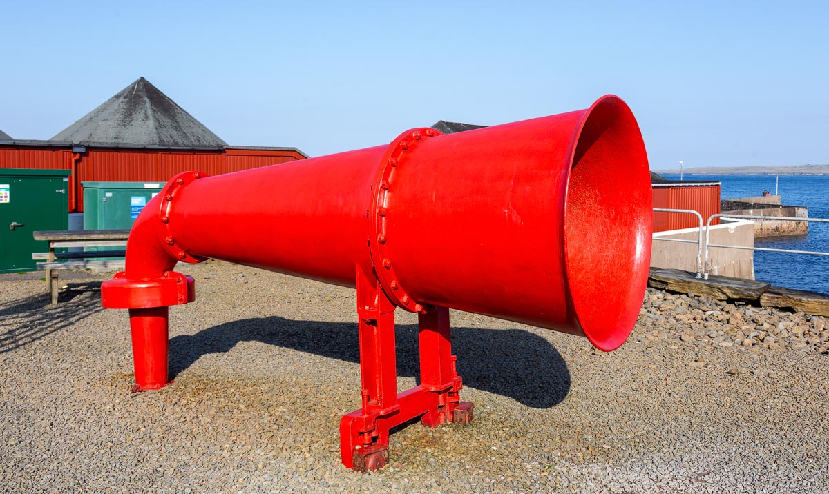 The original red foghorn from Duncansby Head Lighthouse on display at John o' Groats harbour