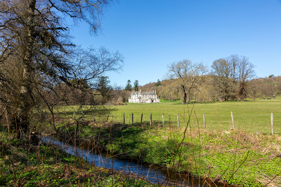 Leith Hall from the pond walk. Woodland and parkland setting.