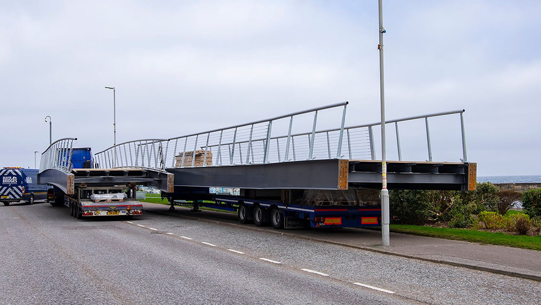 Bridge sections arriving via lorry.