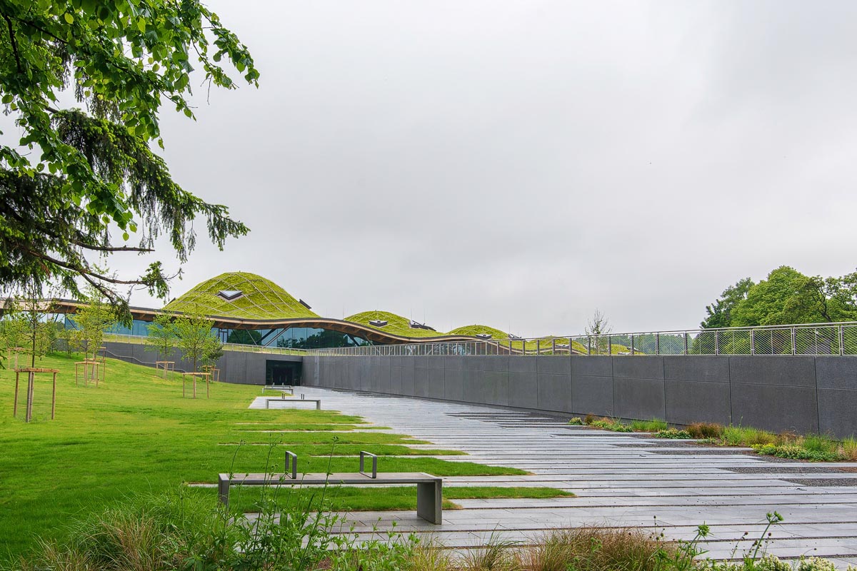 The Macallan visitor centre in Speyside with its distinctive undulating grass-covered roof blending into the landscape