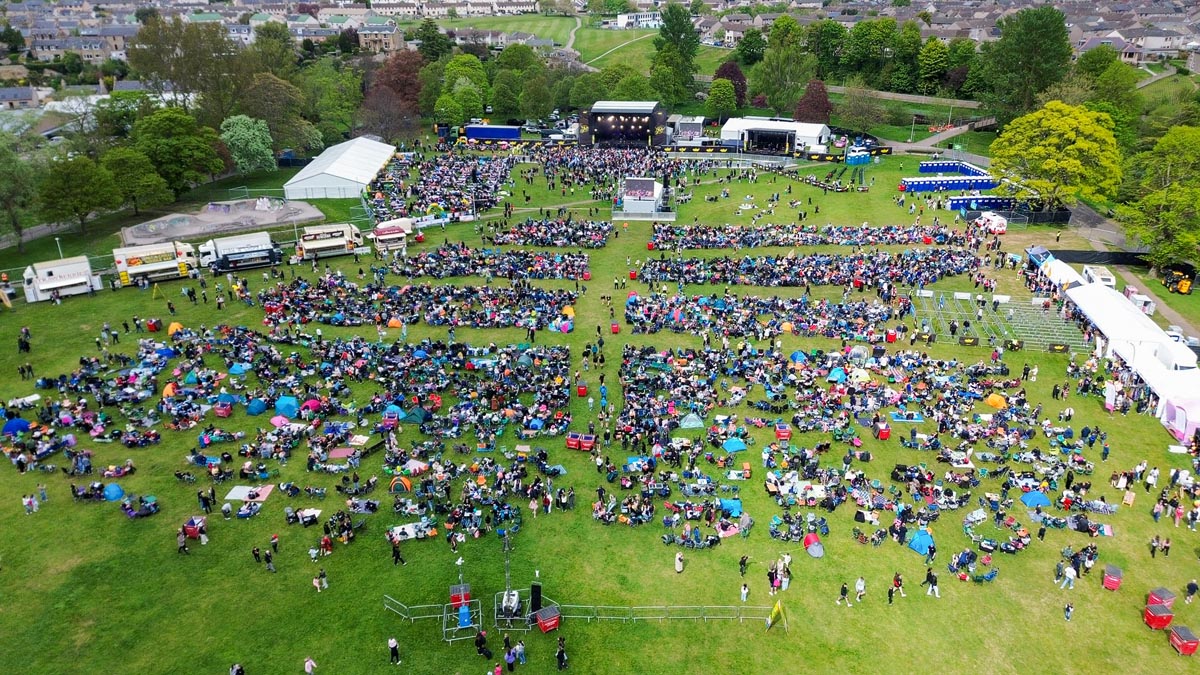 Drone view of MacMoray main stage and packed crowd at Cooper Park, Elgin
