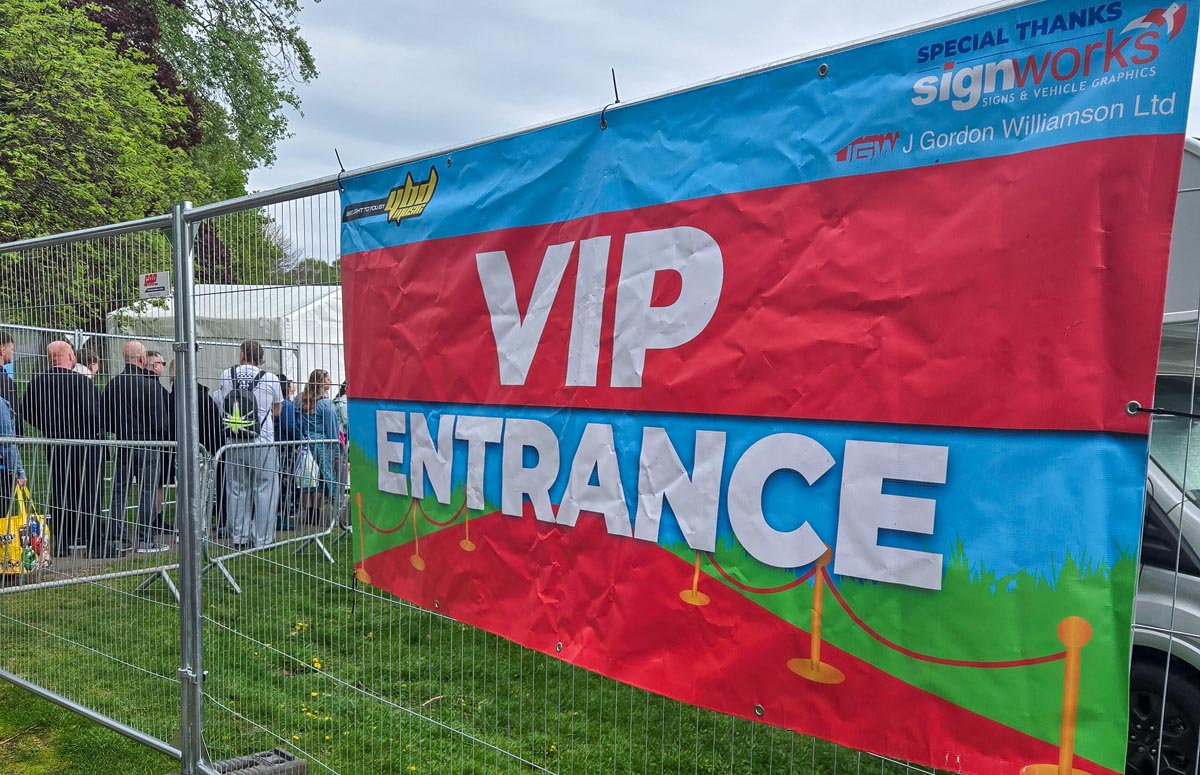 VIP entrance banner at MacMoray Festival in red, blue and green with sponsor logos