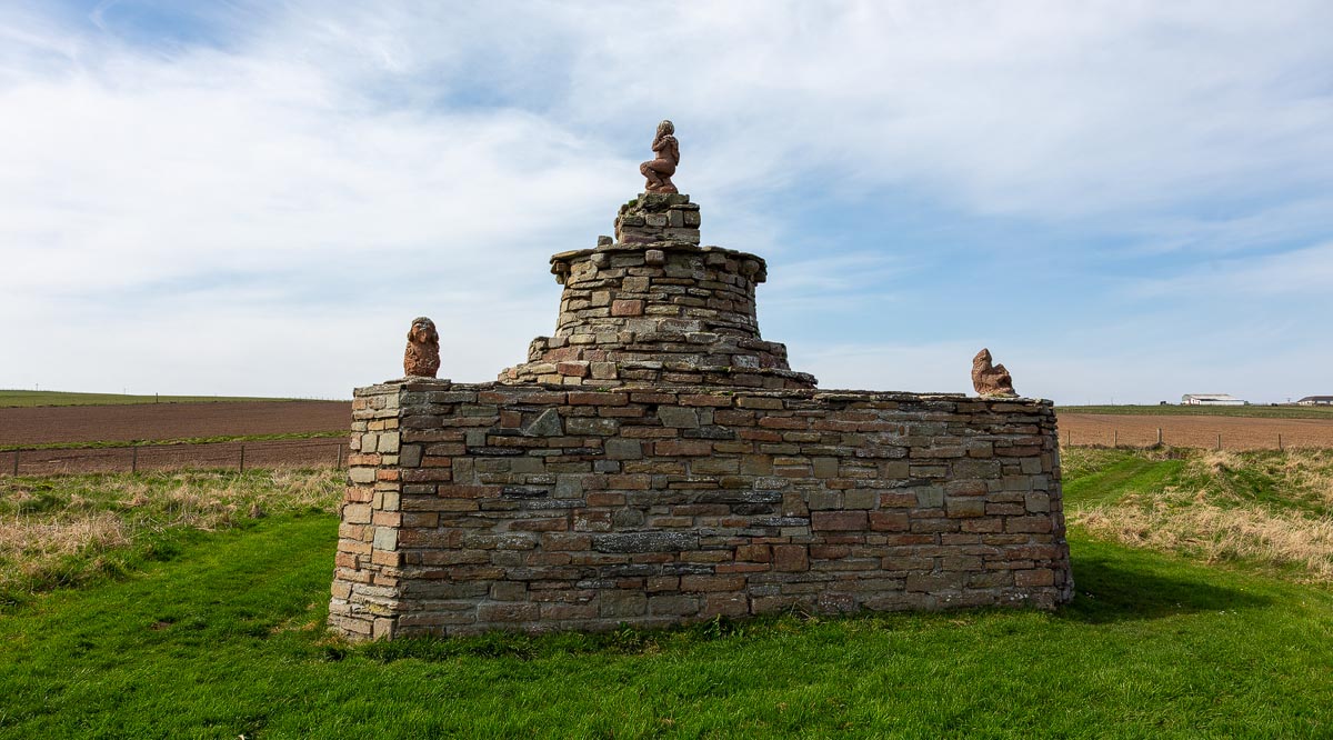 Mervyn’s Tower at Nybster Broch, a stepped stone monument with carved gargoyle figures built by local farmer and sculptor John Nicolson