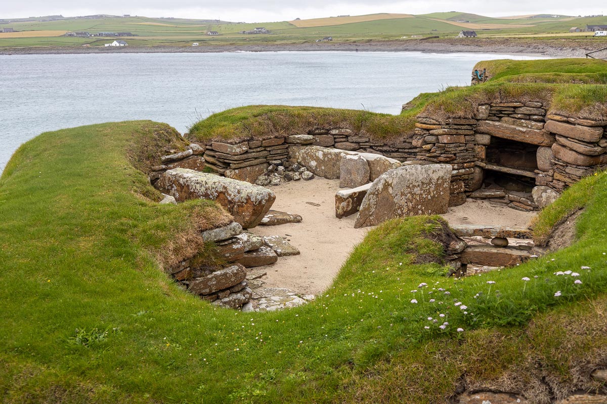 The preserved Neolithic stone dwellings at Skara Brae showing stone furniture and passageways
