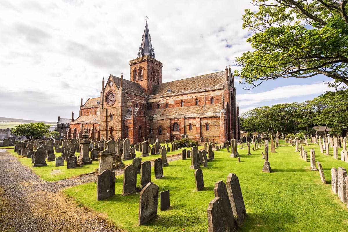 The red and yellow sandstone exterior of St Magnus Cathedral in Kirkwall, Orkney