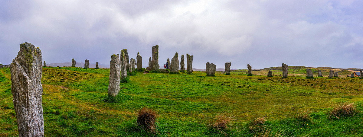 Calanais Standing Stones on the Isle of Lewis under a grey, cloudy sky