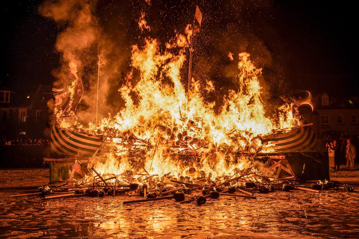 Viking galley engulfed in flames after the torches are thrown in at a Shetland fire festival