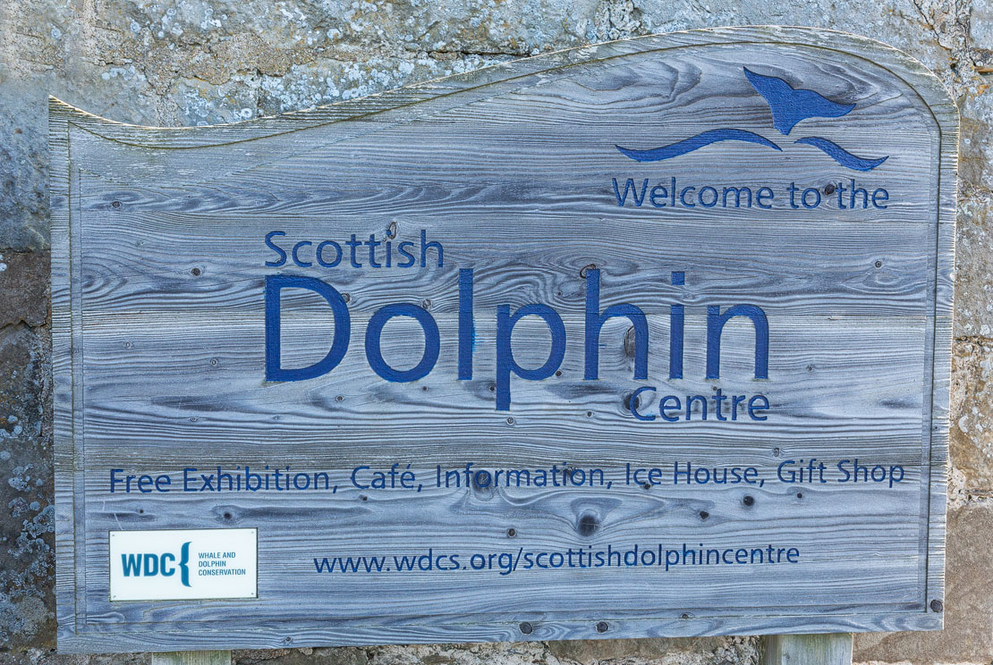 Welcome sign for the Scottish Dolphin Centre.