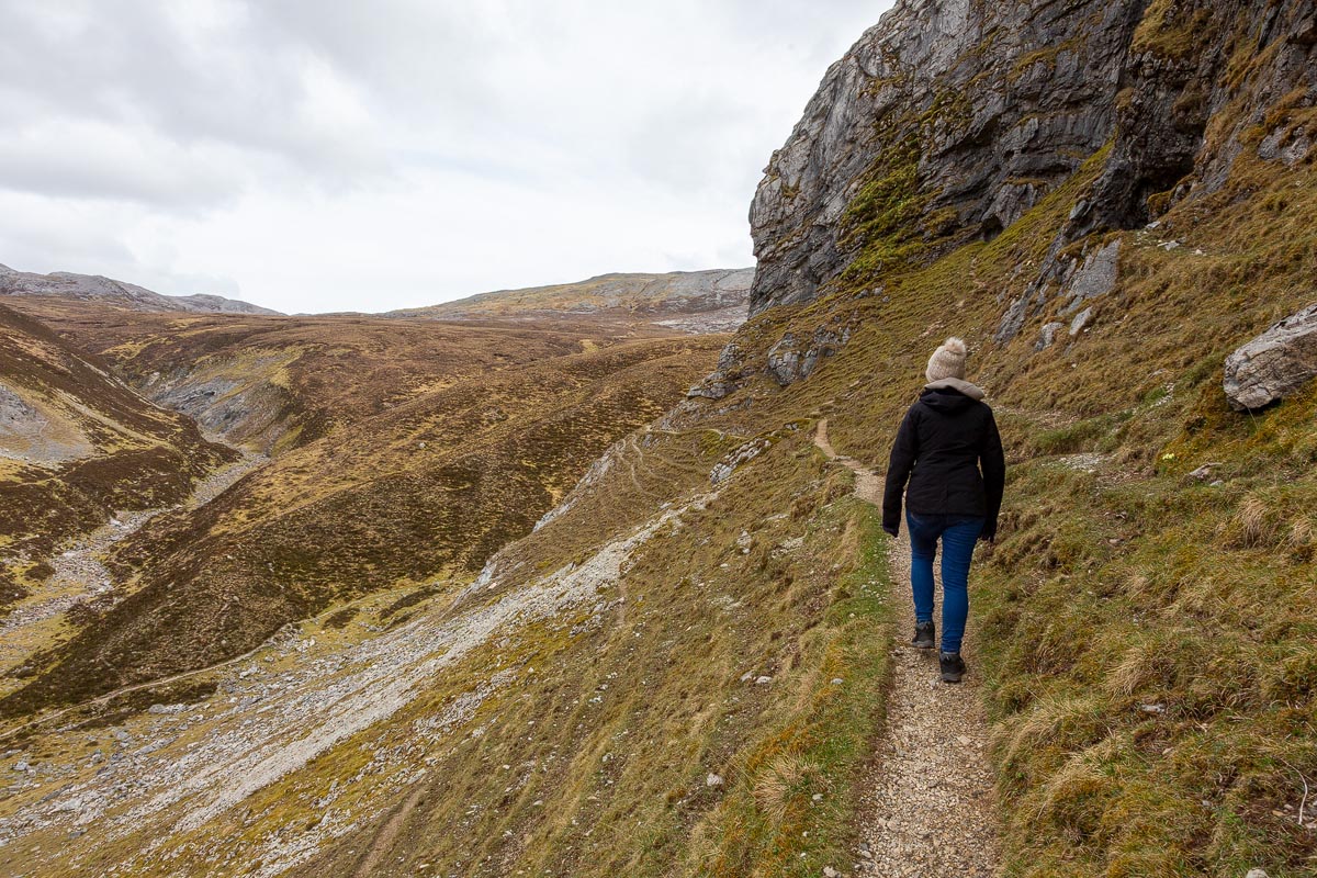 Aerial drone view looking down the Allt nan Uamh valley towards distant mountains in Assynt