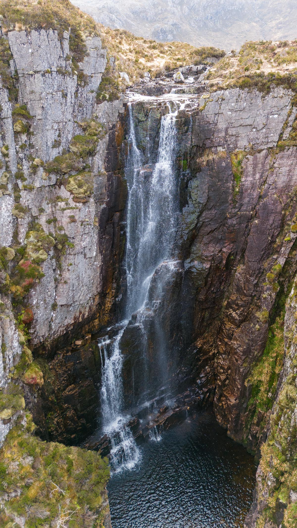 Aerial drone view of Wailing Widow Falls showing the full drop into the gorge pool