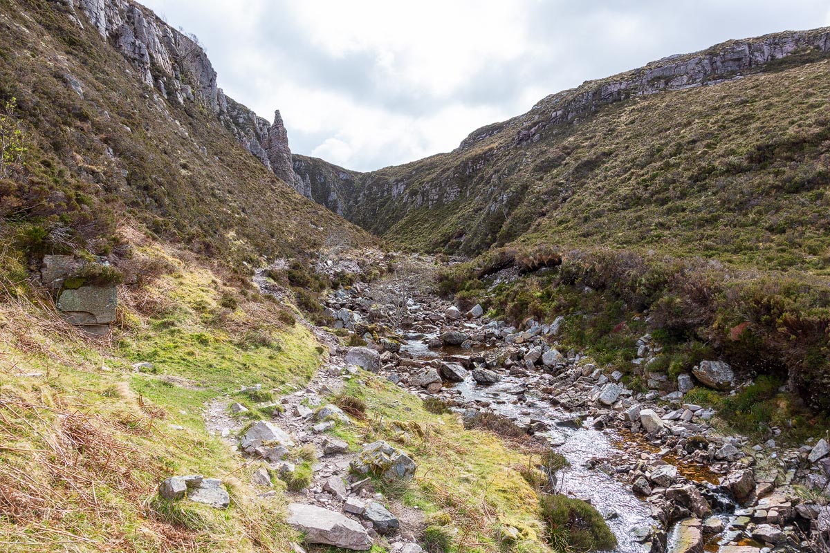 The rocky path leading into the gorge towards Wailing Widow Falls with a distinctive rock pinnacle ahead